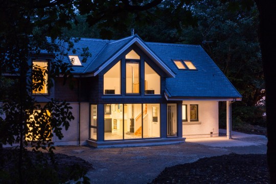 House in the grounds of a listing building