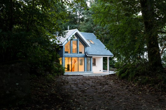 House in the grounds of a listing building